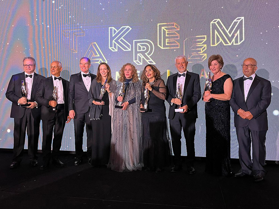 Nine people standing with awards at the Takreem gala